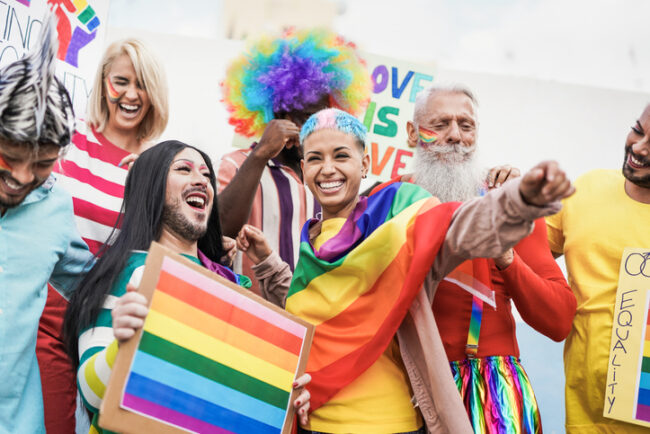 People from different generations have fun at gay pride parade with banner – Lgbt and homosexual love concept